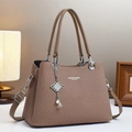 Khaki woven fashion handbag with silver chain pendant and adjustable shoulder strap - Brown