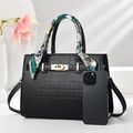 Elegant black crocodile pattern tote bag with gold hardware and decorative silk scarf - Black