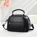 Minimalist black lychee leather handbag with multi-layered design and silver hardware - Black