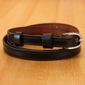 Detail of genuine leather slim belt with silver needle buckle on a wooden background - 105cm / Black