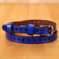 Detail of royal blue leather belt with heart-shaped laser-cut holes and silver buckle - 105cm / Blue