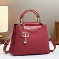 Fashionable red canvas texture handbag with metal handle and elegant gold lettering - Red