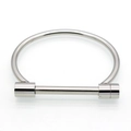 Polished silver horseshoe buckle stainless steel bangle bracelet on white background - Silver