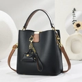 Elegant black lychee leather bucket bag with brown handles and golden hardware - Black