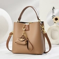 Elegant brown pebbled leather bucket bag with gold chain accessory and shoulder strap - Khaki
