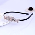 Black thin headband with three sparkling rhinestone butterflies on a white ceramic plate - Silver Butterfly Rhinestone