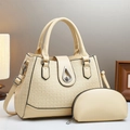 Detailed close-up of beige woven texture handbag with metallic droplet-shaped twist lock - Beige
