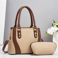 Close-up of woven two-piece handbag set with brown leather trim and golden hardware - Khaki