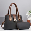 Detail of grey woven texture handbag set with brown leather handles and gold buckle - Black