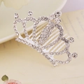 Close-up of sparkling rhinestones on a silver crown hair comb for girls' hair styling - White Style 1