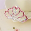 Detailed macro view of pink rhinestones and iridescent crystals on a silver crown hair comb - Pink Style 5