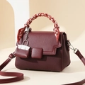 Elegant wine red crossbody bag with textured leather and scarf-wrapped handle detail - 21cm x 10cm x 15cm / Red