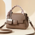 Brown leather and canvas拼接 shoulder bag with scarf handle and mini charm in studio setting - 21cm x 10cm x 15cm / Light Coffee