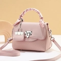 Elegant pink crossbody handbag with woven texture and decorative silk scarf handle - Pink