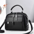 Minimalist black leather crossbody handbag with silver hardware and top handle for women - Black