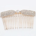 Golden hair comb with rhinestones and central crystal in bow-shaped crown design - Gold