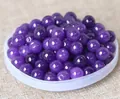 Macro shot of polished purple round beads for DIY jewelry and bracelet making - 8mm / Deep purple