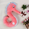 Plush pink seahorse number-shaped doll toy with blue fins on a beige blanket - Number 5-Seahorse