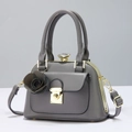 Elegant grey leather handbag with crystal top handle and rose charm detail - Gray