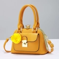 Elegant yellow leather handbag with gold hardware and yellow rose floral charm - Yellow