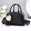 Elegant black PU leather handbag with litchi texture, wide shoulder strap and cat charm - Black