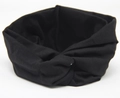 Detail of solid black twisted headband featuring elastic knit fabric and knot design - Black