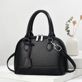 Black lychee leather shell tote bag with silver zippers on white textured stone stand - 23.5x10.5x17cm / Black
