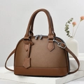 Close-up of brown litchi grain leather handbag with silver hardware on stone stand - 23.5x10.5x17cm / Dark Khaki