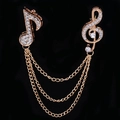 Rose gold musical note brooch set with sparkling crystals and elegant triple layer chains - Gold