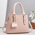 Chic pink macaron handbag with textured finish, gold hardware and adjustable strap - Pink