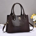 Dark brown faux crocodile leather handbag with golden K logo and adjustable shoulder strap - Coffee