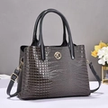 Gray crocodile pattern leather tote bag with gold K logo and adjustable shoulder strap - Gray
