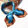 Blue square silk scarf with leopard print accent, tied in a stylish bow on white background - 5007 Bright Blue Leopard