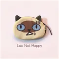 Macro shot of plush Siamese cat coin purse with blue eyes and zipper detail - Funny Siamese Cat