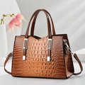 Deep brown crocodile embossed leather handbag with silver hardware and top handles - Khaki/Earth Yellow