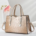Chic beige crocodile embossed leather handbag with top handles and silver hardware - Khaki