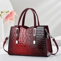 Elegant burgundy crocodile pattern leather handbag with silver accents and top handles - Wine Red