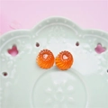 Macro detail of orange resin heart charms with spiral texture for DIY jewelry crafts - Heart Spiral / Orange