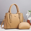 Detail of beige tote bag with vertical stripes, gold hardware, and matching small coin purse - Khaki