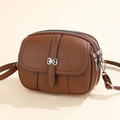 Brown caramel faux leather crossbody bag with three zipper compartments and silver bow - Coffee