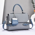 Chic grey-blue woven crossbody bag with circular handle and mini pouch charm - Blue
