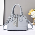 Elegant light blue faux leather shell bag with heart rhinestone charm and silver tassel - Blue