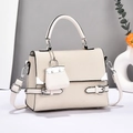 Chic beige canvas patchwork tote bag with top handle and adjustable shoulder strap - Beige