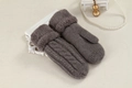 Close-up of grey knit mittens with cable pattern and thick plush faux fur cuffs - One Size / Dark Gray