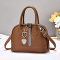 Brown litchi pattern handbag with silver heart tassel pendant and adjustable strap - Earthy Yellow