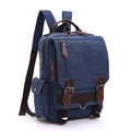 Navy blue vintage canvas backpack with brown leather accents shown from a 45-degree angle - Deep Blue Upgraded Backpack