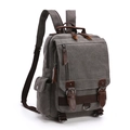 Gray vintage canvas backpack with brown leather trim and metal buckles shown in 3/4 view - Grey Upgraded Backpack