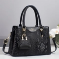 Elegant black faux crocodile skin handbag with top handles and adjustable shoulder strap - Black