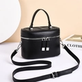 Chic black vanity box crossbody bag with silver hardware and top handle for women - Black