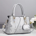 Elegant silver snake print tote bag with golden hardware and mini pouch charm - Silver